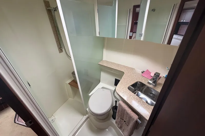 Slide: The Image of Bathroom interior of 2012 Monterey 400 Sport Yacht with shower, sink, and toilet. - 34