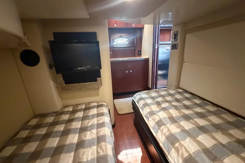 Slide: The Image of Interior of 2012 Monterey 400 Sport Yacht with twin beds and TV. - 37