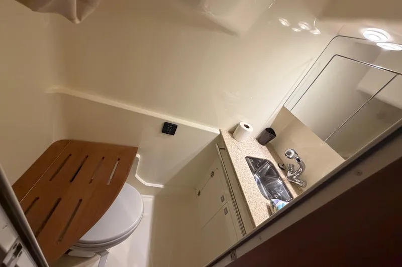 Slide: The Image of Bathroom interior of 2012 Monterey 400 Sport Yacht with sink and toilet. - 39