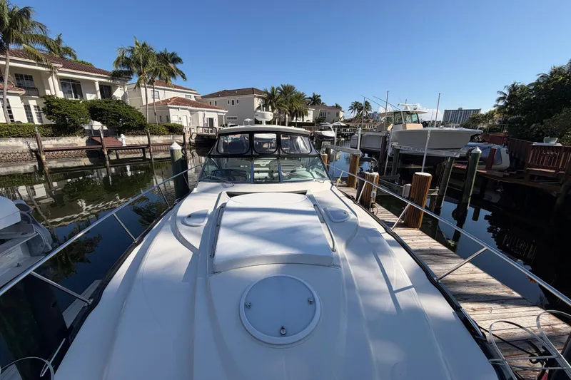 Slide: The Image of 2012 Monterey 400 Sport Yacht docked in a sunny marina setting. - 40