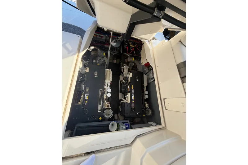 Slide: The Image of Engine compartment of a 2012 Monterey 400 Sport Yacht, showcasing dual engines. - 46