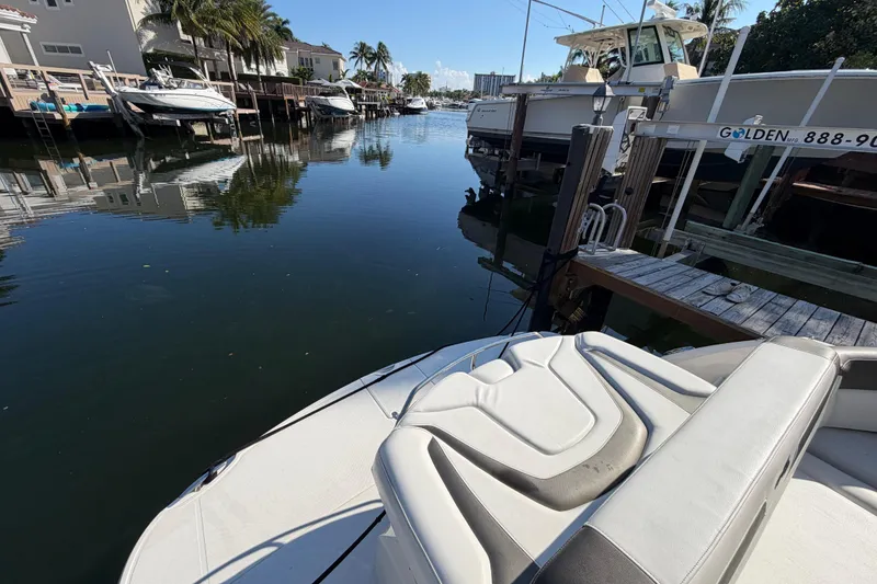 Slide: The Image of 2012 Monterey 400 Sport Yacht docked in a serene marina setting. - 9