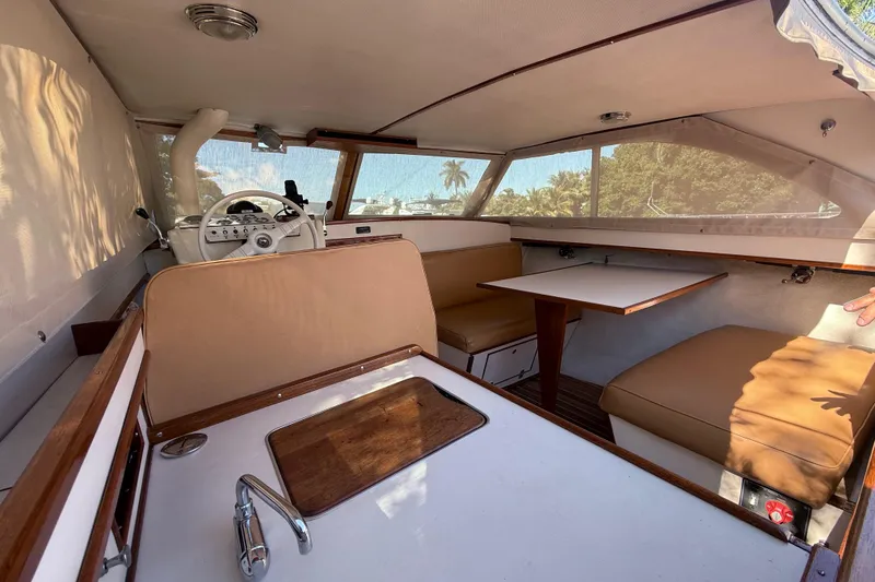 Slide: The Image of Interior of 1969 Custom Alglas Saint John 25 ft. Sportfisher with seating and helm. - 10