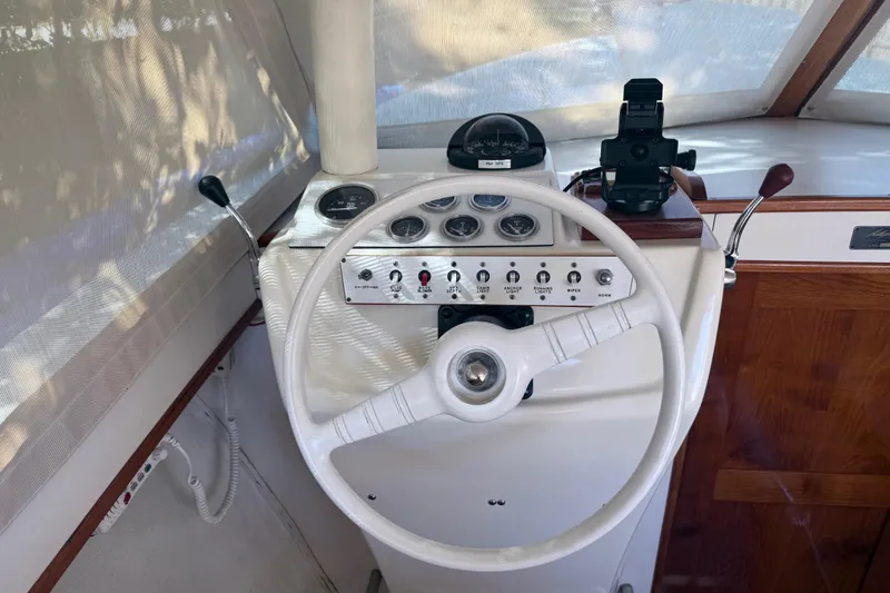 Slide: The Image of 1969 Custom Alglas Saint John 25 ft. Sportfisher helm with vintage controls and steering wheel. - 12