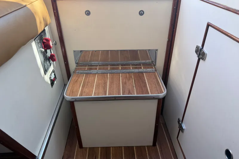 Slide: The Image of Interior of 1969 Alglas Saint John 25 ft. Sportfisher with wood accents and control panel. - 13