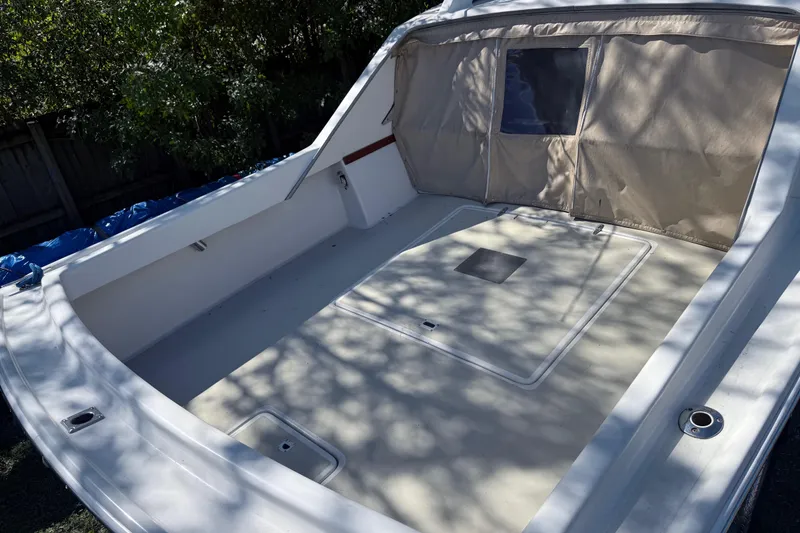 Slide: The Image of 1969 Custom Alglas Saint John 25 ft. Sportfisher boat interior with canopy and storage compartments. - 19