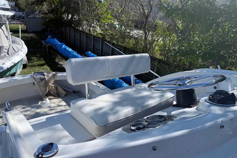 Slide: The Image of 1969 Custom Alglas Saint John 25 ft. Sportfisher boat interior with steering wheel and seating. - 5