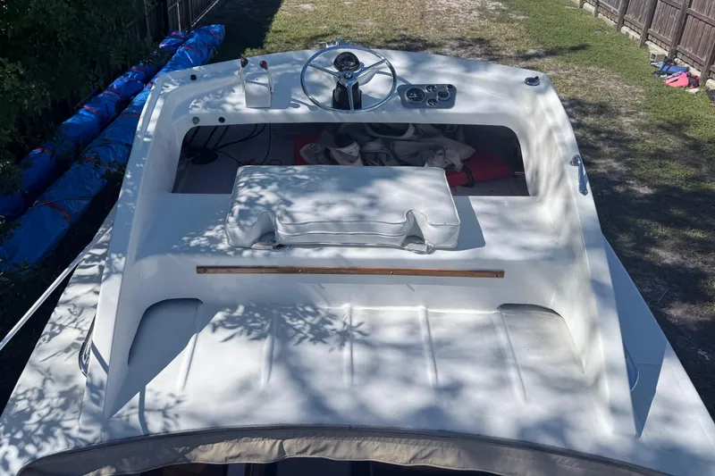 Slide: The Image of 1969 Custom Alglas Saint John 25 ft. Sportfisher boat, top view, white deck, outdoor setting. - 6