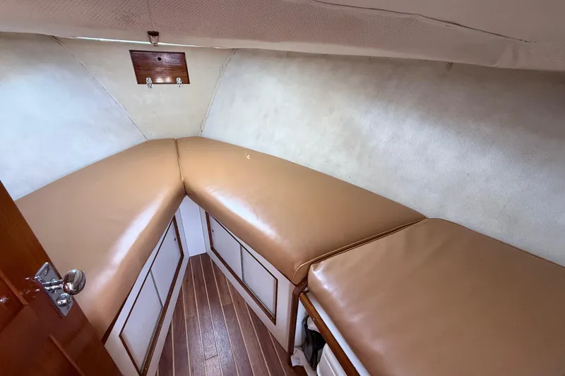 Slide: The Image of Interior cabin of 1969 Alglas Saint John 25 ft. Sportfisher with tan cushions. - 8
