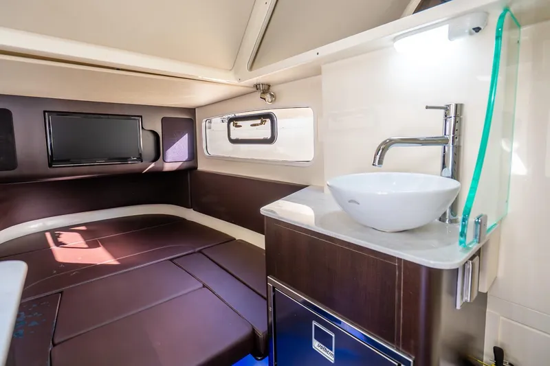 Slide: The Image of Luxurious interior of 2020 Scout 355 LXF boat with modern amenities and sleek design. - 46