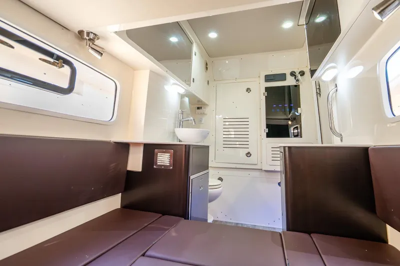 Slide: The Image of Luxurious interior of 2020 Scout 355 LXF boat with modern amenities and seating. - 47