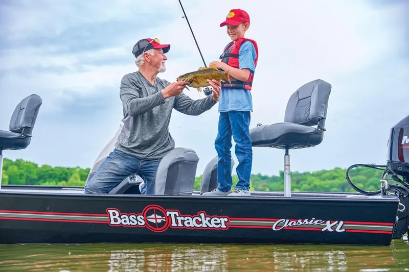 Slide: The Image of Father and son fishing on a 2025 Bass Tracker Classic XL boat. - 15