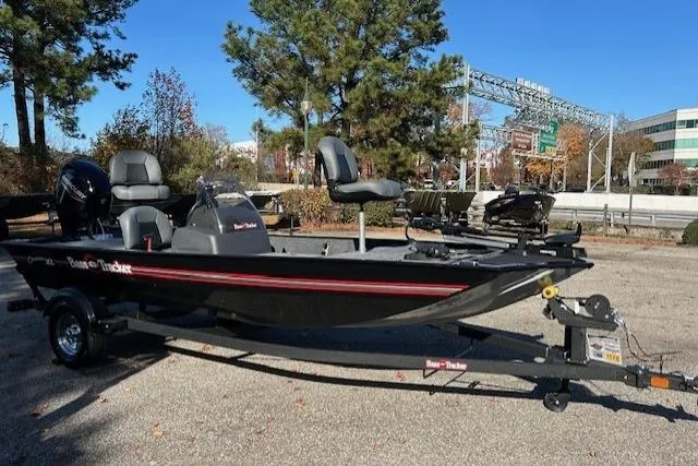 Slide: The Image of 2025 Bass Tracker Classic XL boat on trailer in outdoor setting. - 4