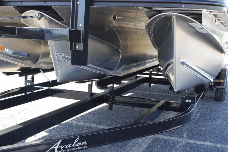 Slide: The Image of 2026 Avalon Venture 85 Rear Fish pontoon boat on trailer, close-up view. - 10