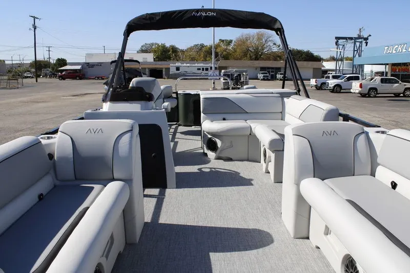 Slide: The Image of 2026 Avalon Venture 85 Rear Fish pontoon boat with spacious seating and modern design. - 11
