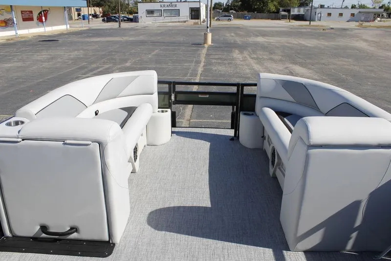 Slide: The Image of 2026 Avalon Venture 85 Rear Fish boat interior with plush seating and cup holders. - 14