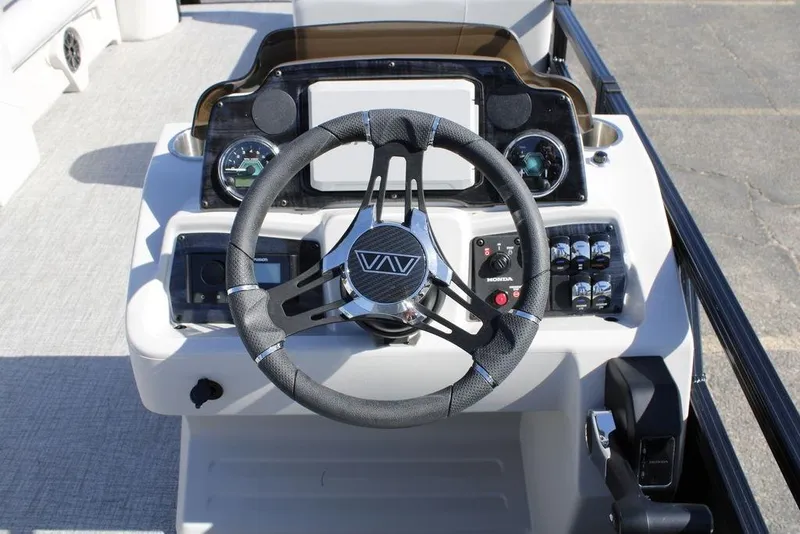 Slide: The Image of Steering console of 2026 Avalon Venture 85 Rear Fish boat with modern controls. - 19