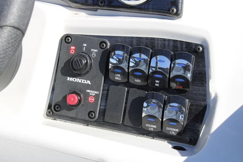 Slide: The Image of Control panel of 2026 Avalon Venture 85 Rear Fish boat with Honda ignition and switches. - 24