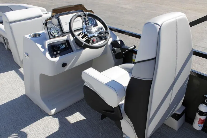 Slide: The Image of 2026 Avalon Venture 85 Rear Fish boat cockpit with steering wheel and controls. - 25
