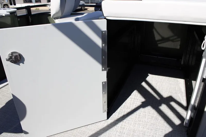 Slide: The Image of Open storage compartment on 2026 Avalon Venture 85 Rear Fish boat. - 29