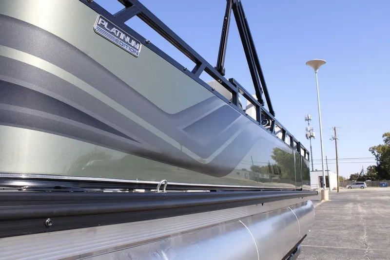 Slide: The Image of 2026 Avalon Venture 85 Rear Fish boat, Platinum Edition, side view with sleek design. - 3
