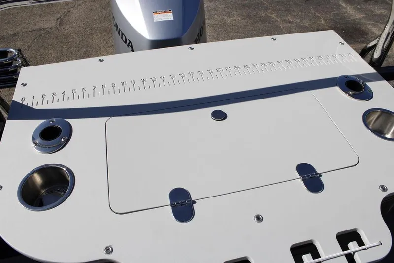 Slide: The Image of 2026 Avalon Venture 85 Rear Fish boat deck with measurement ruler and cup holders. - 34