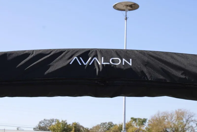 Slide: The Image of Avalon Venture 85 Rear Fish 2026 boat cover with logo, outdoor setting. - 35