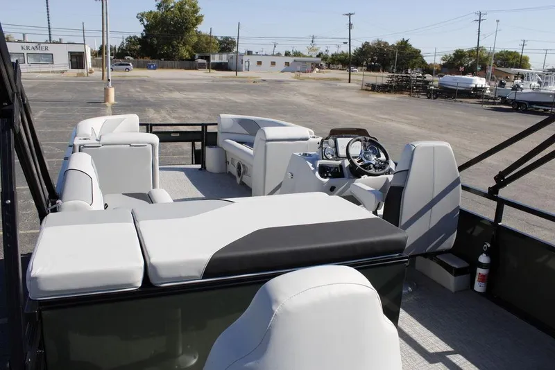 Slide: The Image of 2026 Avalon Venture 85 Rear Fish pontoon boat interior with modern seating and steering console. - 39