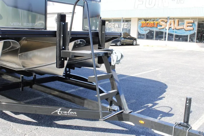 Slide: The Image of 2026 Avalon Venture 85 Rear Fish boat on trailer at dealership sale. - 6