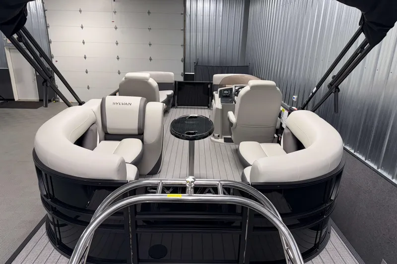 Slide: The Image of 2026 Sylvan Mirage X1 pontoon boat interior with plush seating and modern design. - 16