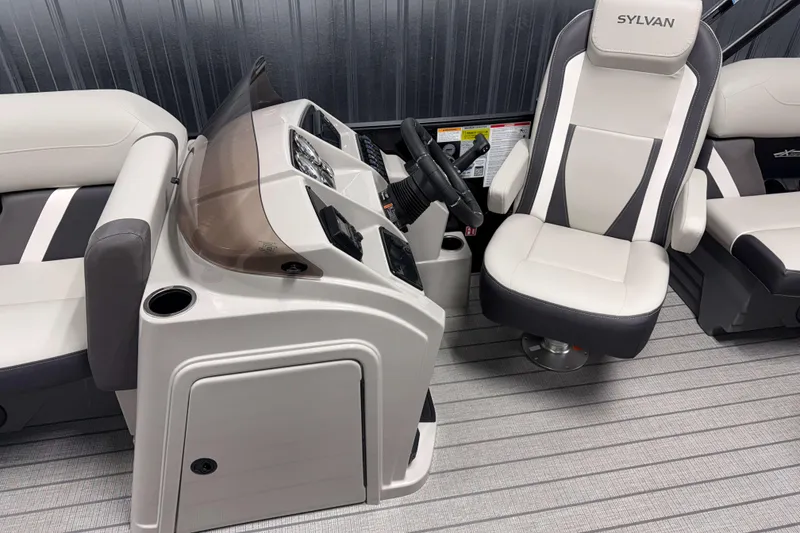 Slide: The Image of Interior of 2026 Sylvan Mirage X1 boat with modern helm and seating. - 6