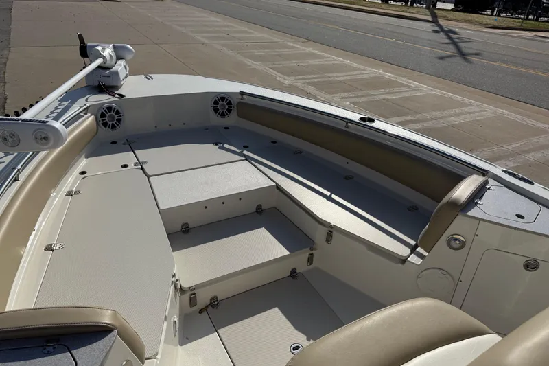 Slide: The Image of 2019 Stingray 236 CC boat interior with seating and storage compartments. - 10