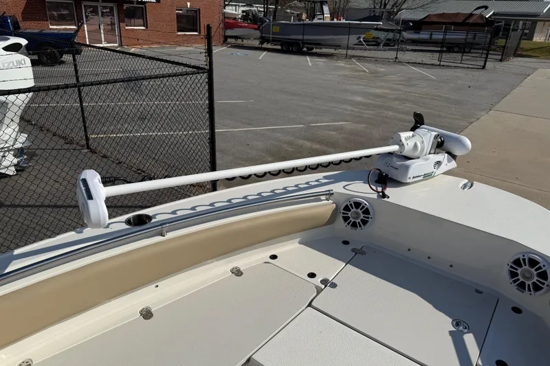 Slide: The Image of 2019 Stingray 236 CC boat with trolling motor in a parking lot. - 19