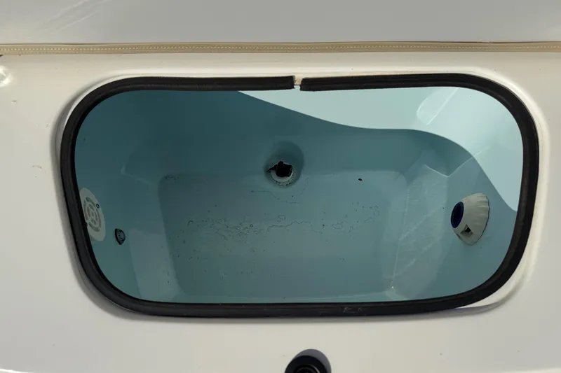 Slide: The Image of Livewell compartment of a 2019 Stingray 236 CC boat, interior view. - 26