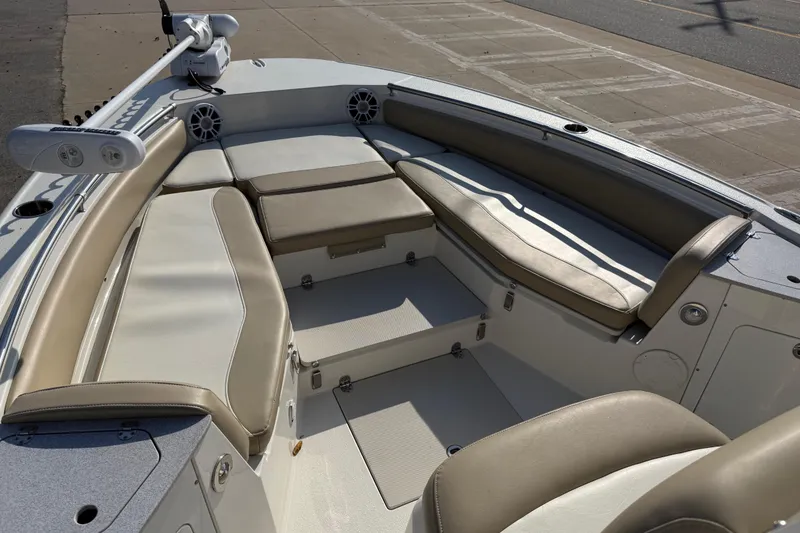Slide: The Image of 2019 Stingray 236 CC boat interior with cushioned seating and modern design. - 28