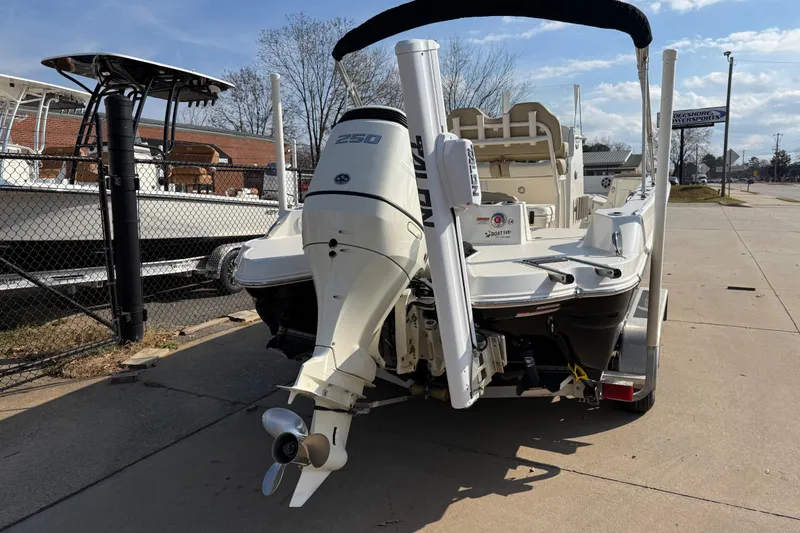 Slide: The Image of 2019 Stingray 236 CC boat with powerful outboard motor, parked on a trailer. - 4