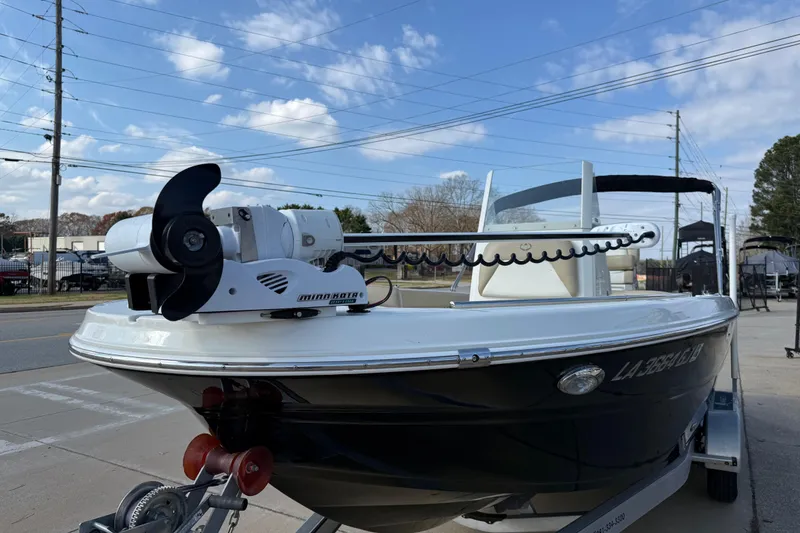 Slide: The Image of 2019 Stingray 236 CC boat on trailer with Minn Kota trolling motor. - 40