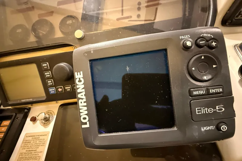 Slide: The Image of Lowrance Elite-5 marine GPS on 1988 Trojan 13 Meter Express 430 dashboard. - 26