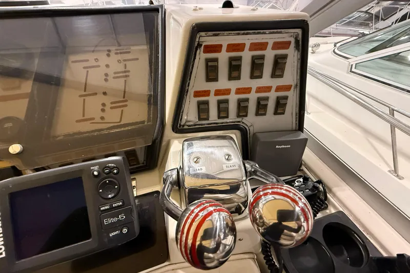 Slide: The Image of Control panel of a 1988 Trojan 13 Meter Express 430 boat with navigation equipment. - 27