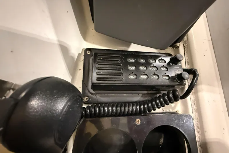 Slide: The Image of Control panel of a 1988 Trojan 13 Meter Express 430 boat with various function buttons. - 29