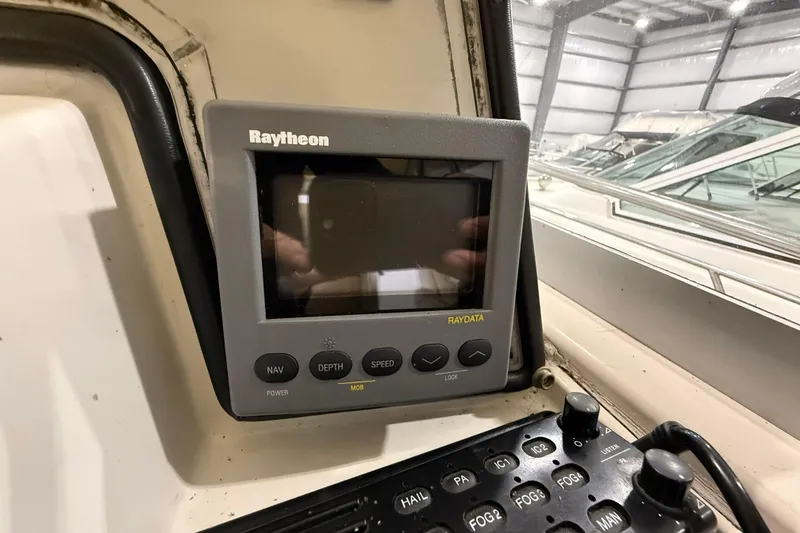 Slide: The Image of Raytheon navigation system on 1988 Trojan 13 Meter Express 430 boat, indoor setting. - 32