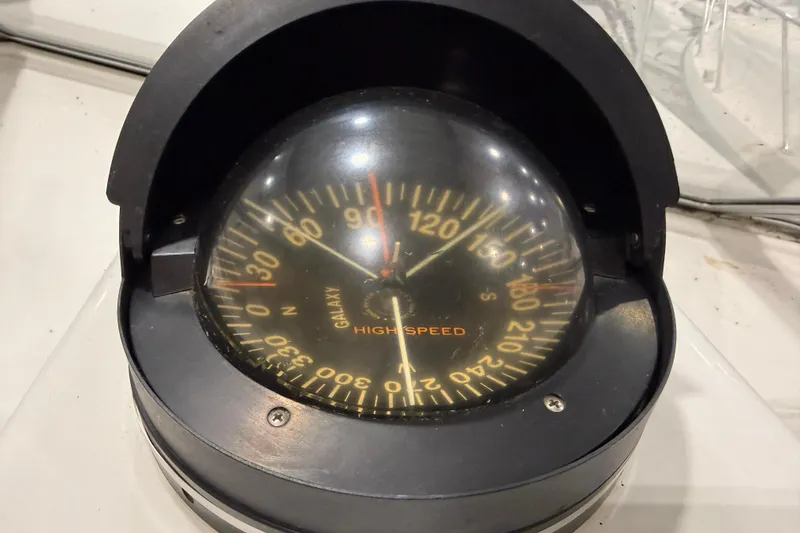 Slide: The Image of Compass on 1988 Trojan 13 Meter Express 430 boat, marked "Galaxy High Speed." - 34