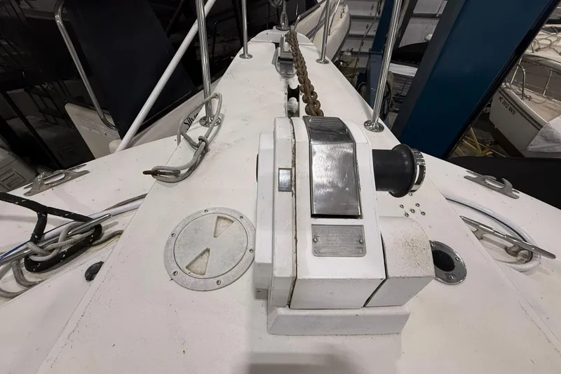 Slide: The Image of 1988 Trojan 13 Meter Express 430 yacht deck with anchor winch and chain. - 37