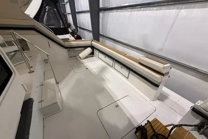 Slide: The Image of 1988 Trojan 13 Meter Express 430 boat interior with seating and storage. - 43