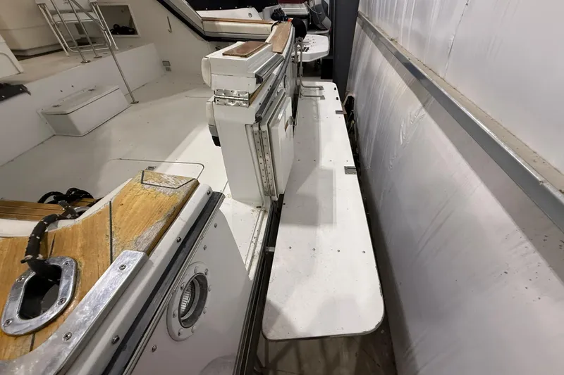 Slide: The Image of 1988 Trojan 13 Meter Express 430 boat interior with white and wood accents. - 44