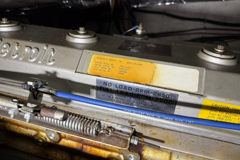 Slide: The Image of Engine details of a 1988 Trojan 13 Meter Express 430 boat. - 52