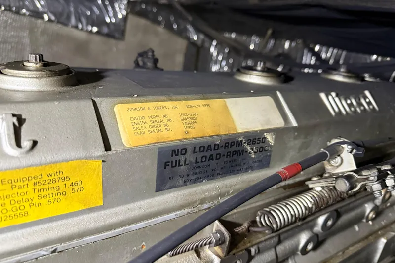 Slide: The Image of Close-up of a 1988 Trojan 13 Meter Express 430 engine with visible labels and specifications. - 53