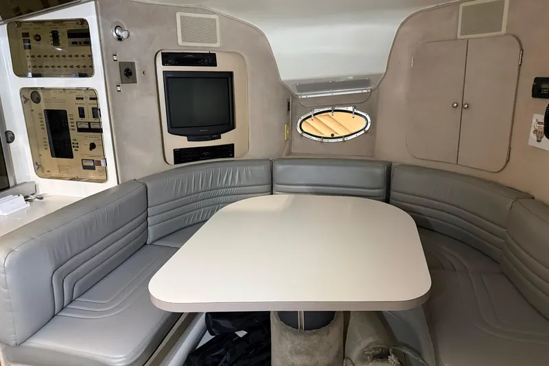 Slide: The Image of Interior of 1988 Trojan 13 Meter Express 430 yacht with seating and entertainment system. - 9