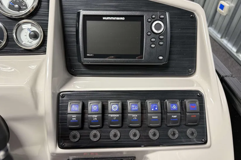 Slide: The Image of Control panel of 2026 Sylvan Mirage X1 with Humminbird Helix 5 display and switches. - 10