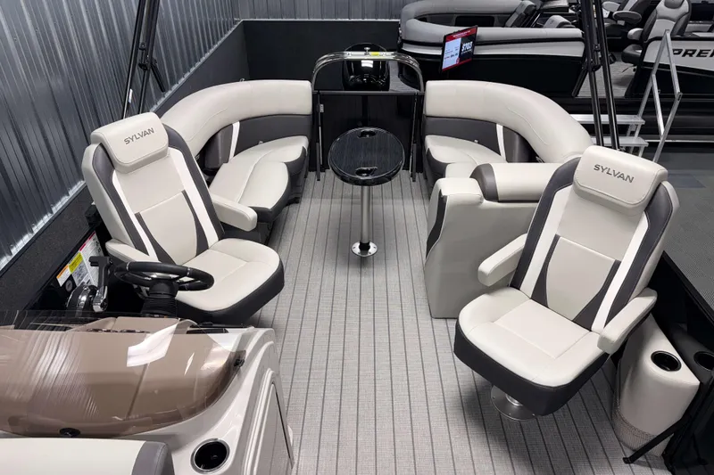 Slide: The Image of 2026 Sylvan Mirage X1 boat interior with luxurious seating and modern design. - 5